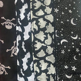 An image showing the various scarf patterns available including skull and crossbones, pentagrams, bats and ghosts. The design this listing would purchase is the skull and crossbones, this is a black background with white skull and crossbones.