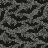 Close up of the fabric. A grey background with black spiderweb outlines and black bat silhouettes. This is a poly cotton mix fabric with vibrant and pigmented colour.