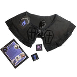 A detachable collar in a gothic style associated with lolita goth, Victorian goth and romantic goth. Black cotton with black lace trimming and black ribbon tie up detail, with a velvet transfer of coffins with crosses inside. With leaflets + stickers