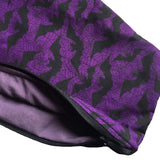 A close up of the bats coffin cosmetics bag which shows the zip and the lining inside the product which is a dark shade of purple. The zip is black, blends in, and is neatly hemmed.