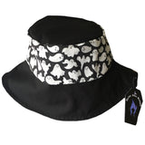 A summer goth hat with a black and white ghost fabric. A reversible design with two wearing options. Suitable for a goth summer party, a goth beach hat, or a goth Easter party. The fabric is black and white ghosts in various sizes.