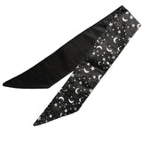 Lightweight cotton fabric scarf folded once to show front and back side. The front side fabric is an alternative gothic styled print of black background and white pentagrams and moons, and the back side fabric is black. The edges are neatly hemmed.