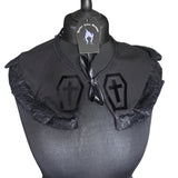 Coffin Love Collar: A detachable collar in a gothic style associated with lolita goth, victorian goth and romantic goth. Black cotton with black lace trimming and black ribbon tie up detail, with a velvet transfer of coffins with crosses inside. The perfect valentines gift for a gothic lover