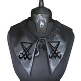 A detachable collar in a gothic style associated with Fetish goth, Nu goth and romantic goth. Black cotton lining and black faux leather top layer with black lace trimming and black ribbon tie up detail, with a velvet transfer of the sigil of lucifer. The perfect valentines gift for a gothic lover