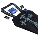 Large coffin shape shoulder bag with cross on the frontside and a velvet transfer outline. The shoulder straps are hemmed with black lace. It is made from a mix of block black cotton and bats and spiderweb print fabric. With leaflets + stickers