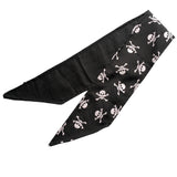 Lightweight cotton fabric scarf folded once to show front and back side. The front side fabric is an alternative gothic styled print of black background and white skull and crossbones, and the back side fabric is black. The edges are neatly hemmed.