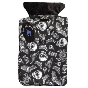 A goth hot water bottle made from an alternative fabric featuring skulls, crows, bats, tarantulas, eyeballs and sweets. It has a velvet top and a back opening. The lining fabric is a toweling fabric. I tcomes in giftable packaging. A black and white striped bag with stickers and a leaflet.