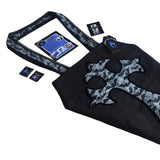 Large coffin shape shoulder bag with cross on the frontside and a velvet transfer outline. The shoulder straps are hemmed with black lace. It is made from a mix of block black cotton and bats and spiderweb print fabric. With leaflets + stickers