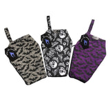 Three coffin make up bags with gothic fabrics including a purple bats and spiderwebs coffin shape bag, grey bats and spiderwebs coffin shape bag, and a gothic fabric coffin shape bag featuring skulls, crows, eyeballs and spiders.