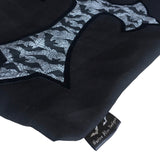 Large coffin shape shoulder bag with cross on the frontside and a velvet transfer outline. The shoulder straps are hemmed with black lace. It is made from a mix of block black cotton and bats and spiderweb print fabric. With leaflets + stickers